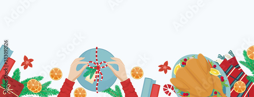 Christmas holiday dinner. Flat lay with turkey with cranberries, pumpkin pie, champagne, fir branches and gifts. Place for text