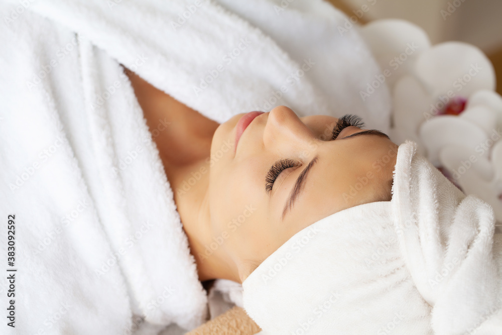 Young woman enjoying of facial massage in spa salon Young woman enjoying of facial massage in spa salon