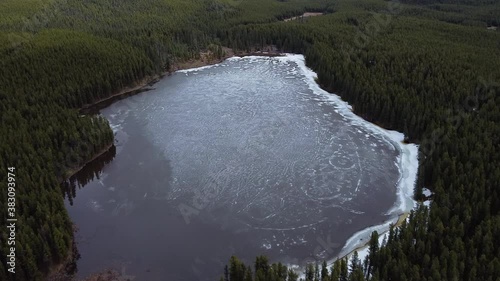 Drone flying over frozen lake photo