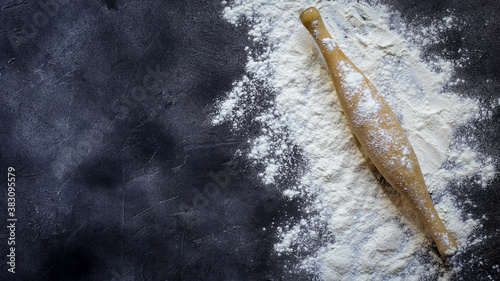 flour for baking on a dark background