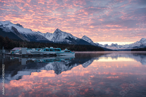 Wall Mural Ferry pier and colorful altocumulus clouds on Maligne Lake at Jasper national pa