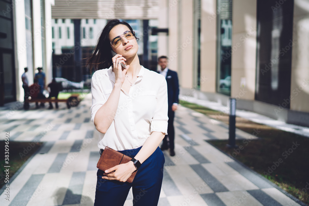 Confident ethnic woman talking on smartphone Confident ethnic woman talking on smartphone