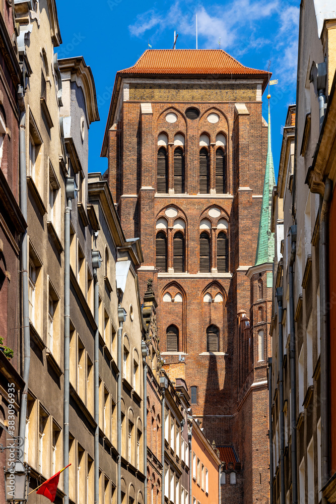 Twin towers of St. Mary’s Basilica - Bazylika Mariacka - seen from Kaletnicza street in the historic old town city center quarter in Gdansk, Poland