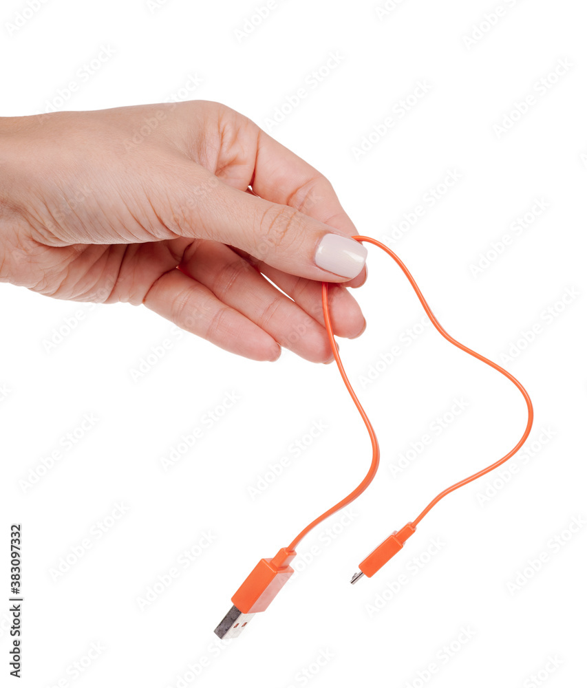 Hand with USB cable, connection wire. Isolated on white background. Hand with USB cable, connection wire. Isolated on white background.