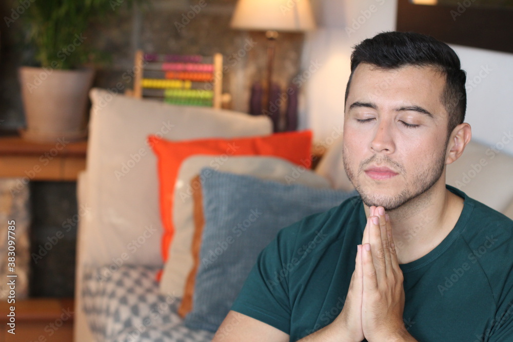 Young ethnic man praying with copy space
Young ethnic man praying with copy space