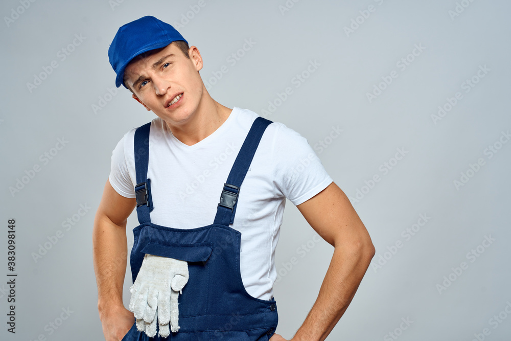 working man in uniform service lifestyle delivery service light background