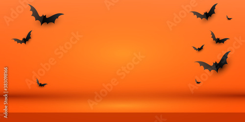 Minimal creative orange background layout design with a flock of black paper bats. Vector illustration with copy space