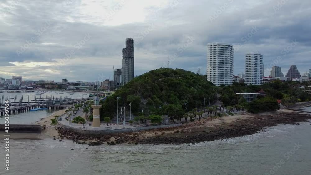 Sideways along headland with lighthouse Pattaya City at first light Sideways along headland with lighthouse Pattaya City at first light