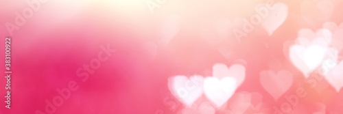 Defocused blurred heart shaped lights. Valentines Day background.