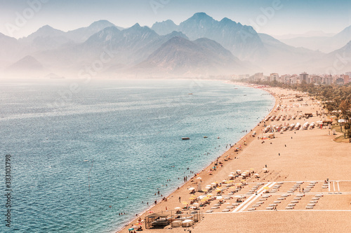 Fototapeta Naklejka Na Ścianę i Meble -  Aerial view of the famous longest Konyaalti beach in Antalya. Vacation and tour on the Mediterranean coast of Turkey