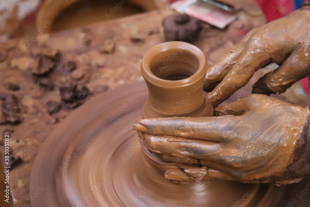 Dirty Hands Of Potter Making Pottery From Mud Using Spinning Potter Wheel Dirty Hands Of Potter Making Pottery From Mud Using Spinning Potter Wheel
