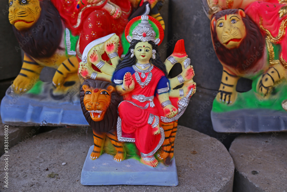 Fototapeta premium Idols of Hindu Goddess Durga for Navratri festival in India. The nine-days festival, which commemorates the slaying of the demon king Mahishasur by goddess Durga, marks the triumph of good over evil.