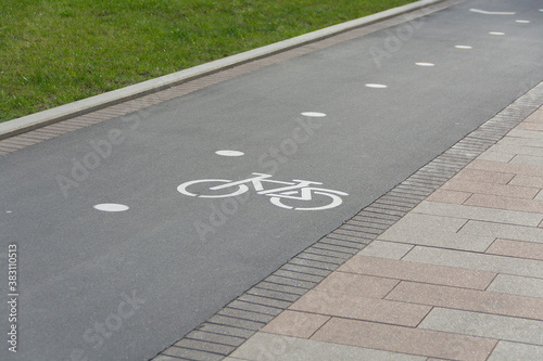 a special path with signs for cyclists in the city park