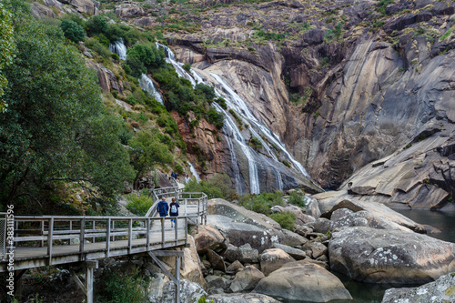 Fototapeta Naklejka Na Ścianę i Meble -  Ézaro Waterfall, Dumbría, La Coruña, Galicia, Spain. Wooden walkway and waterfall of the Jallas River.