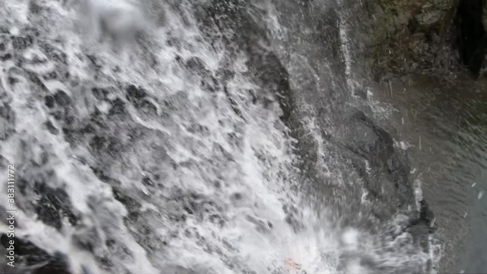 Waterfall Cascade In Slow Motion At A Tropical Forest In Maharashtra, India - tilt-up shot, macro Waterfall Cascade In Slow Motion At A Tropical Forest In Maharashtra, India - tilt-up shot, macro