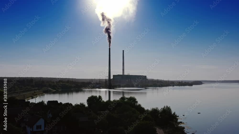 Industrial zone with large pipes. Thick white smoke is pouring in contrast to the sun. Pollution of the environment. Video. Industrial zone with large pipes. Thick white smoke is pouring in contrast to the sun. Pollution of the environment. Video.