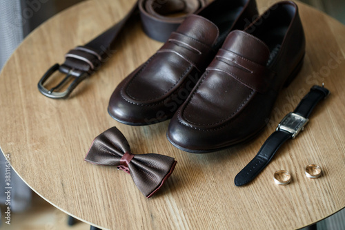 Mens elegant set of stylish groom accessories for wedding day. Men's classic shoes