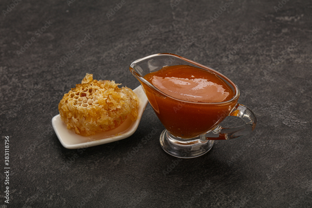 Natural honey in the bowl