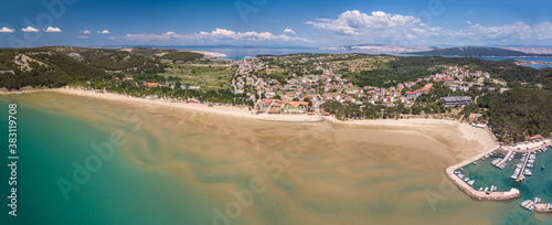 Aerial panorama of beautiful Rajska beach on the Rab island in Croatia. Paradise beach on the island of Rab in Croatia - the largest sandy beach in Lopar. photo