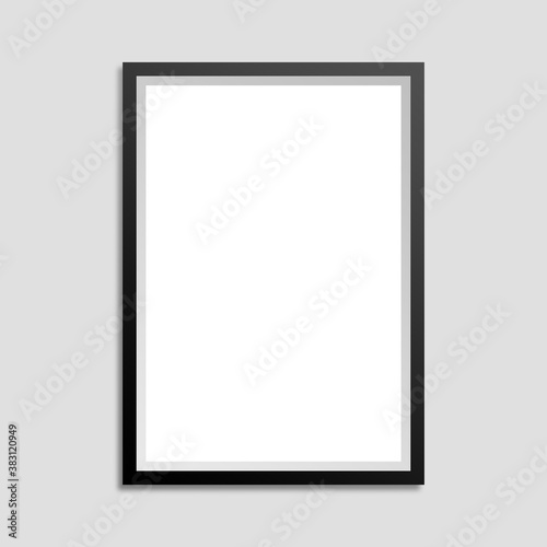 Black frame with white background and shadow on a gray wall