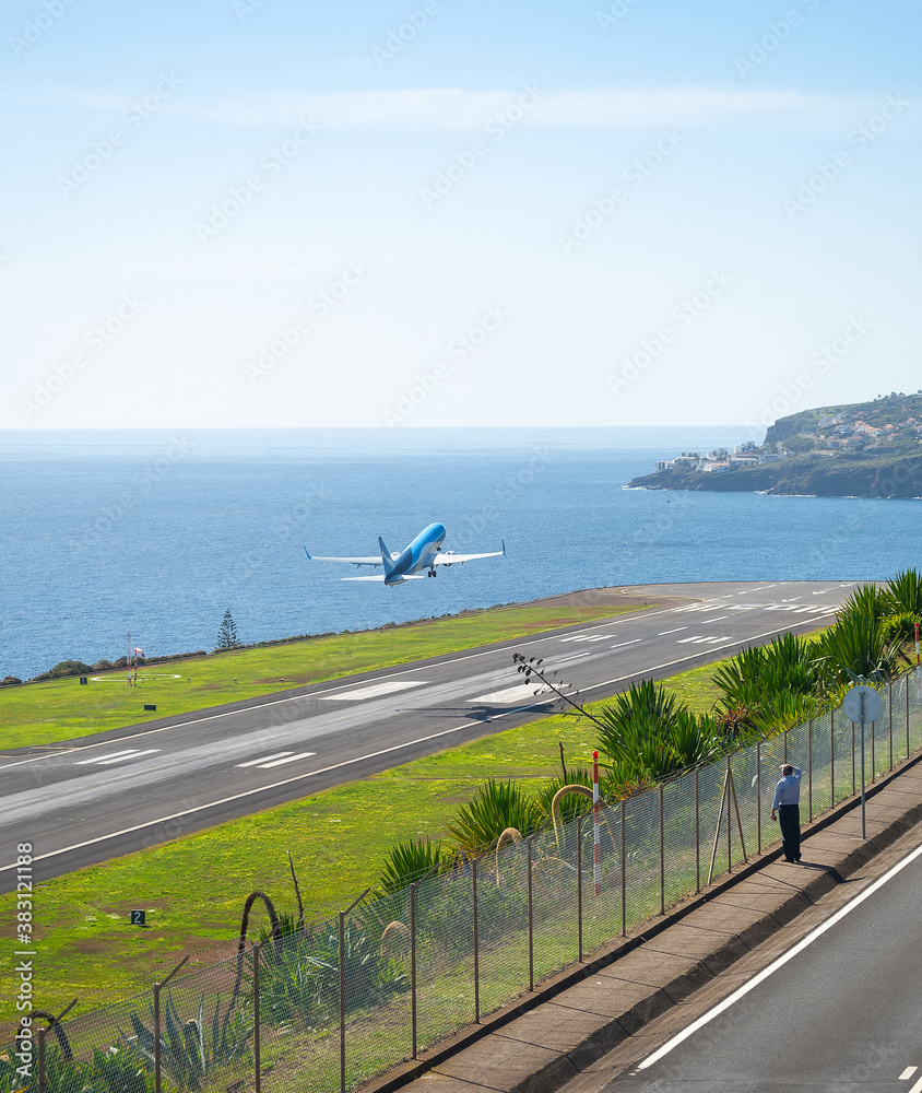 Man airplane take-off airport Madeira