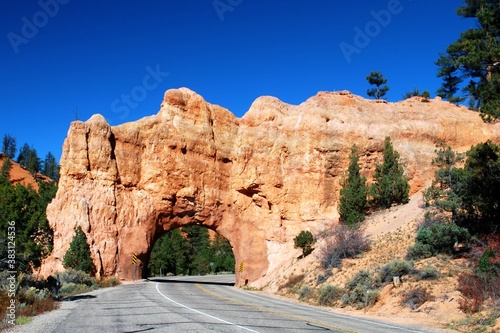 The road tunneled through a huge rock at Bryce Cayon Garfield County Utah., 