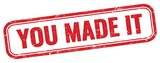 YOU MADE IT text on red grungy stamp.