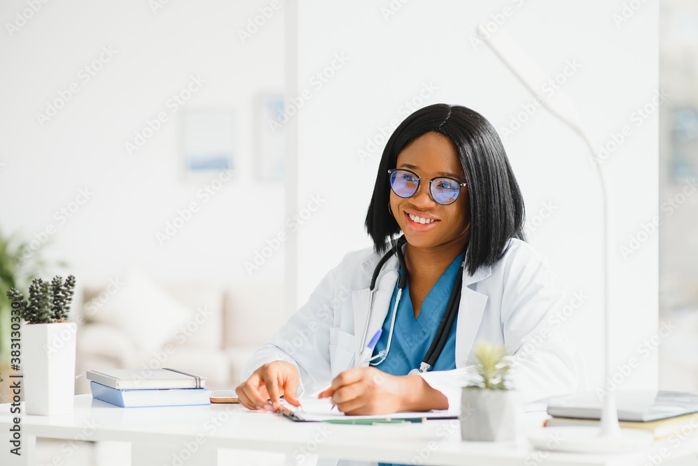 African American doctor working in her office at clinic African American doctor working in her office at clinic