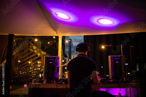 DJ plays music at an outdoor party