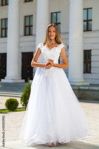 Young beautiful girl in ballroom prom dress © Andrey_Arkusha