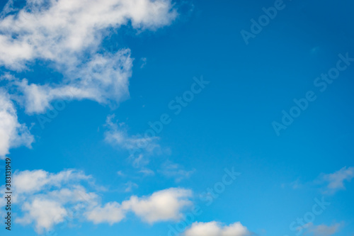 Blue sky background with a tiny clouds