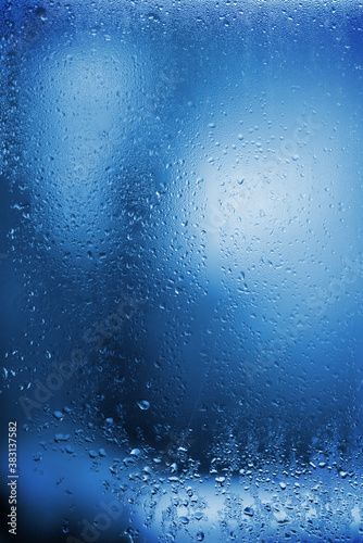  Glass with drops rain blue color texture