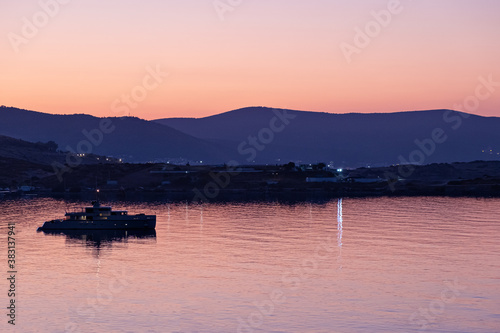 Nature background with sea and mountanes landscape at sunset or sunrise with red oringe colours photo