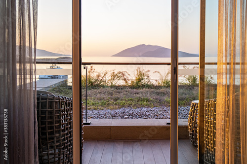 Фототапет Hotel room terrace balcony with a sea view The window overlooking the ocean