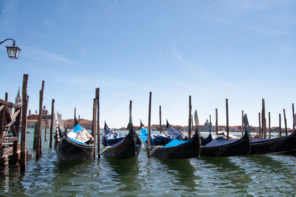 gondolas moored for the night at dawn in venice