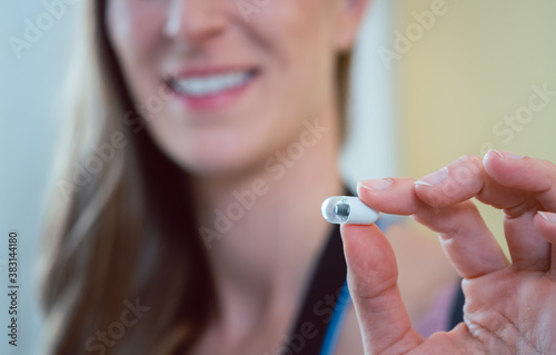 Bild auf Leinwand Patient in hospital holding video pill for capsule endoscopy