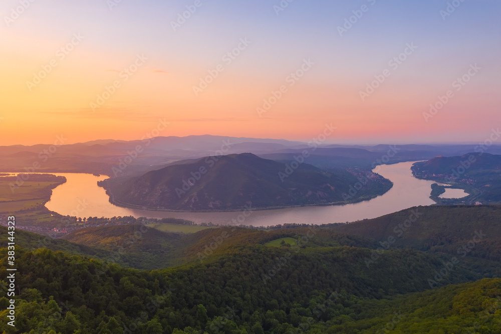 Predikaloszek, Hungary - Aerial view of the Danube bend with beautiful summer sunset, warm orange color.