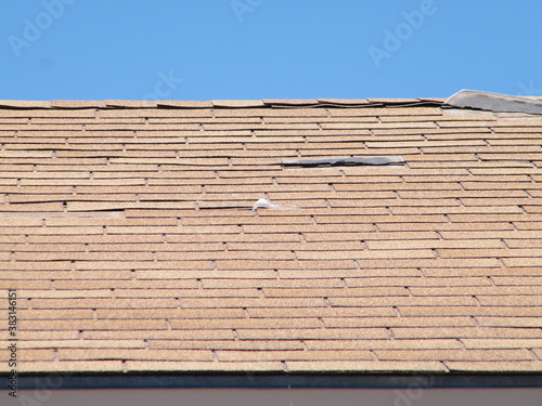 Roof Shingle Damage from Wind.
