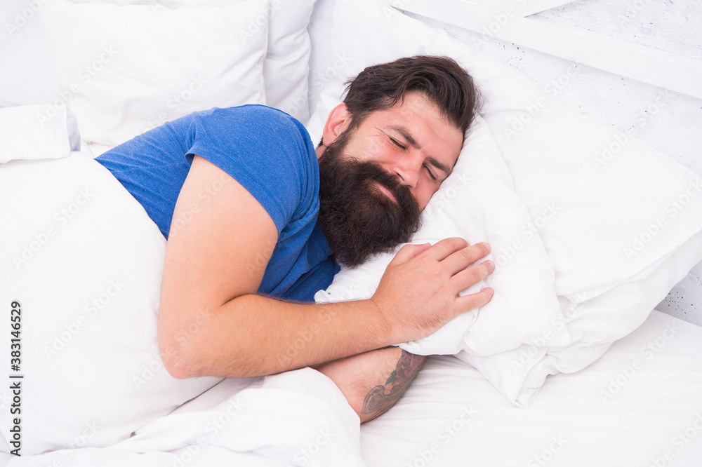 pleased caucasian brutal man with mustache smiling in bed at bright room, healthy lifestyle pleased caucasian brutal man with mustache smiling in bed at bright room, healthy lifestyle
