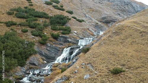 Alpine waterfall tracking shot