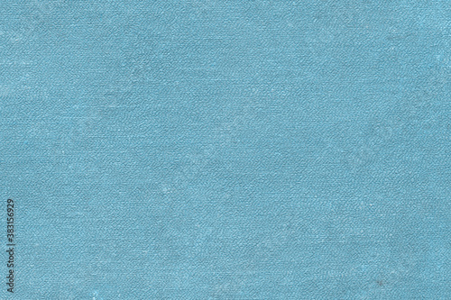 Vintage and old looking paper background. Colored blue retro book cover. Ancient book page.