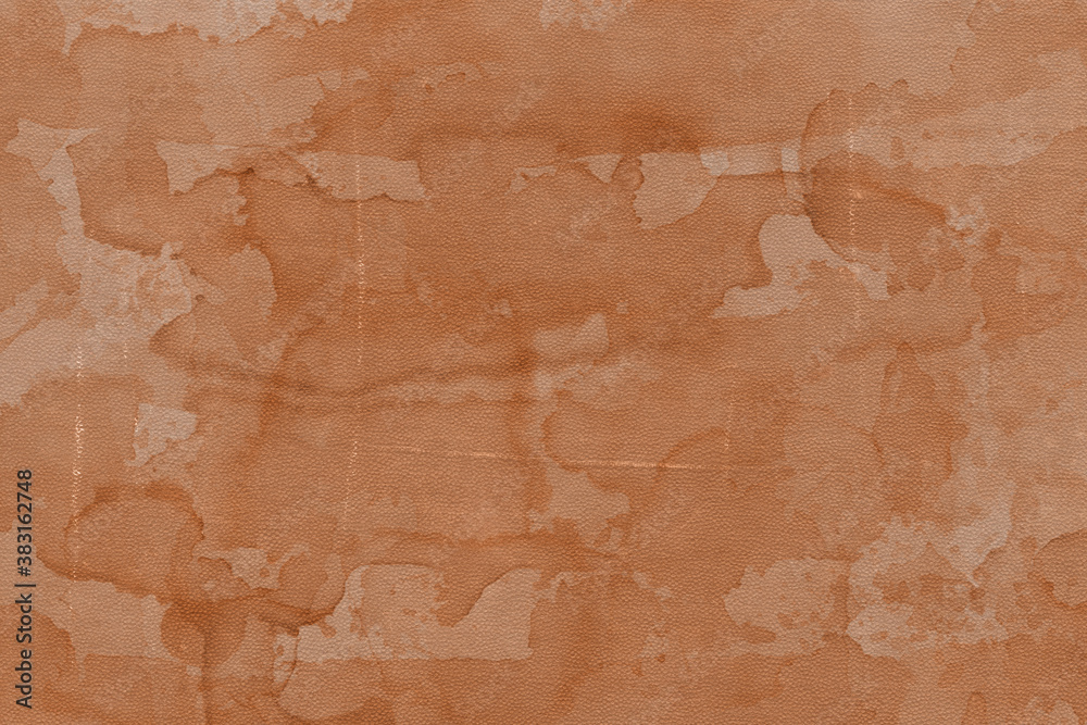 Vintage and old looking paper background. Colored orange with a brown retro book cover. Ancient book page.