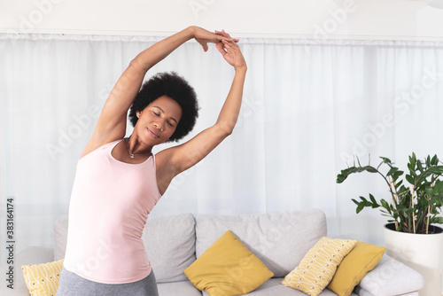 Woman stretching with eyes closed