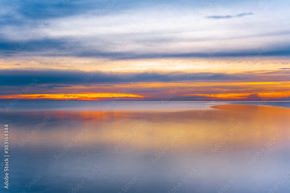 Sunset over sea - long exposure minimalist sunset with copy space