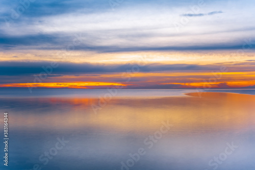 Sunset over sea - long exposure minimalist sunset with copy space