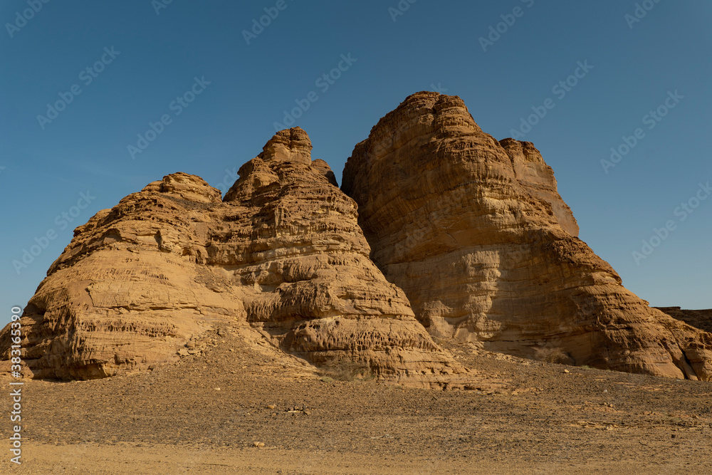 Outcrop geological formations at sunrise near Al Ula in Saudi Arabia Outcrop geological formations at sunrise near Al Ula in Saudi Arabia