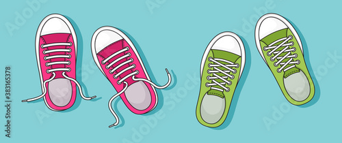 Colorful pair sneakers with shadow on blue background. Top view. Casual youth shoes. Vector illustration