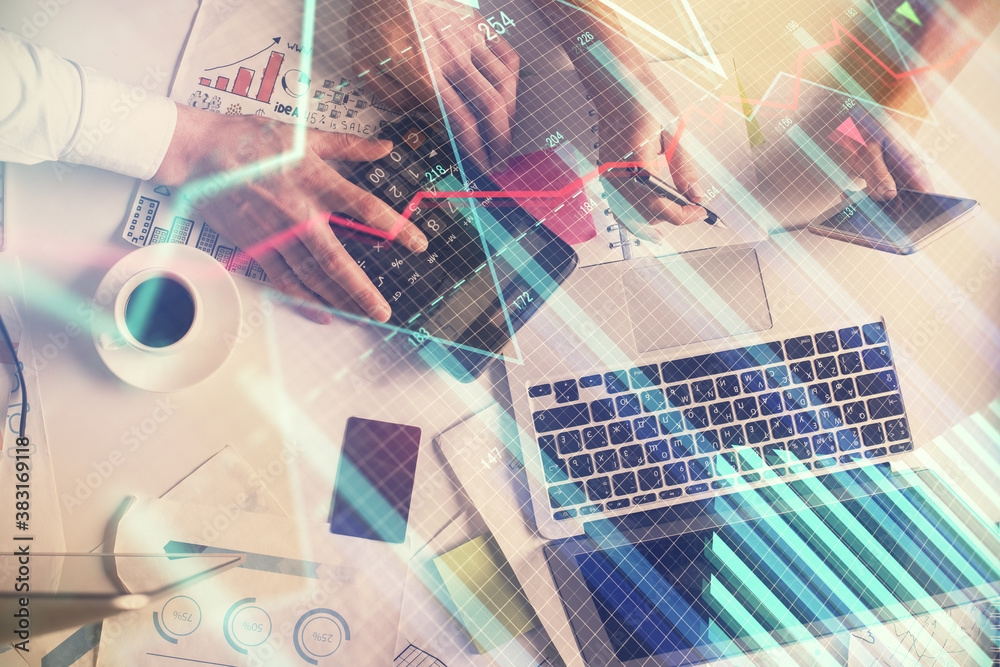 Double exposure of man and woman working together and financial chart hologram drawing. market analysis concept. Computer background. Top View. Double exposure of man and woman working together and financial chart hologram drawing. market analysis concept. Computer background. Top View.