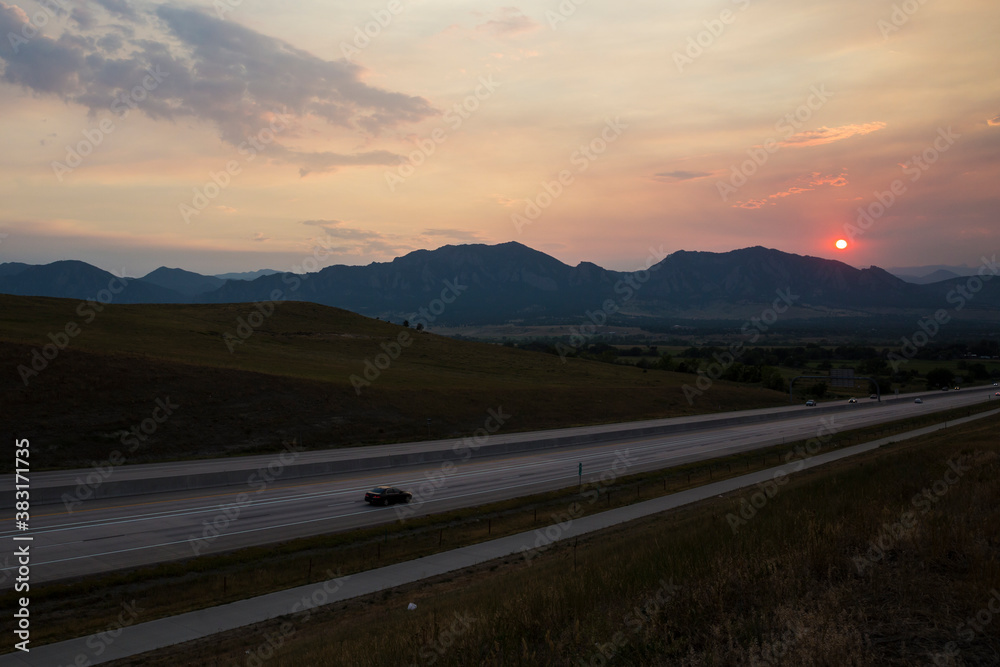 A red sunset in Colorado covered up by forest fire smoke, as seen just outside of Boulder.