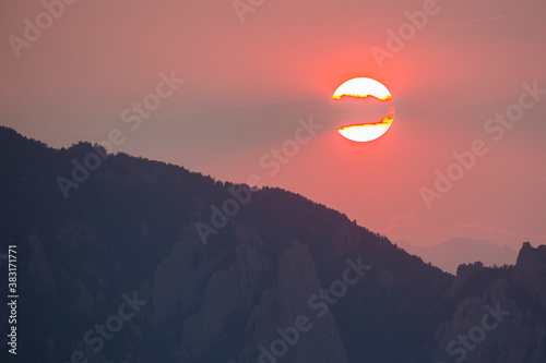 A red sunset in Colorado covered up by forest fire smoke, as seen just outside of Boulder.